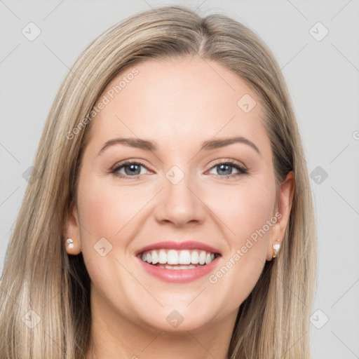 Joyful white young-adult female with long  brown hair and grey eyes