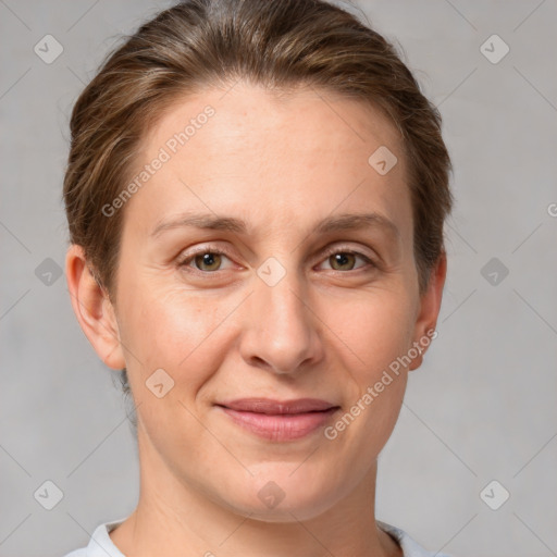 Joyful white adult female with short  brown hair and grey eyes