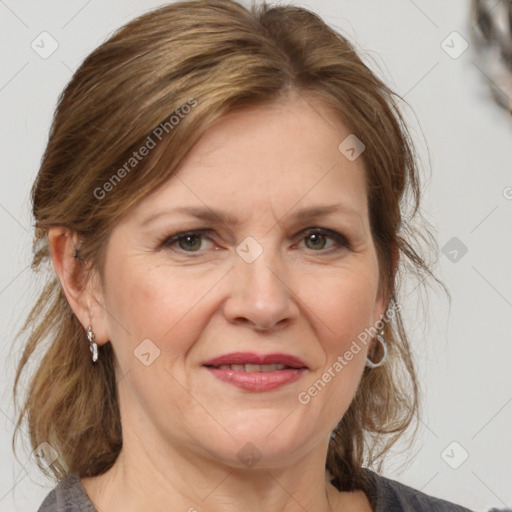 Joyful white adult female with medium  brown hair and grey eyes