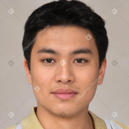 Joyful asian young-adult male with short  black hair and brown eyes