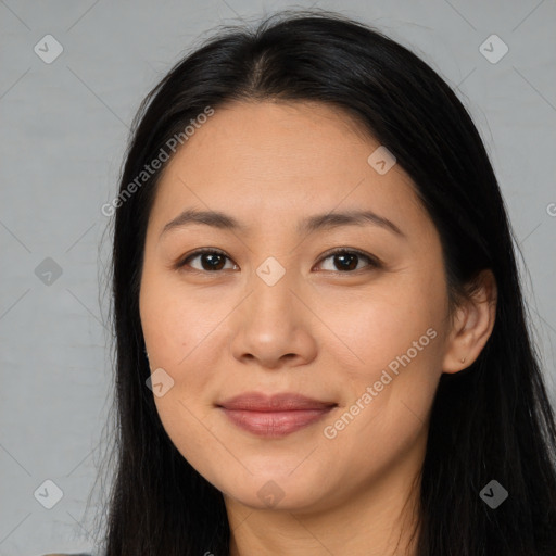 Joyful latino young-adult female with long  brown hair and brown eyes