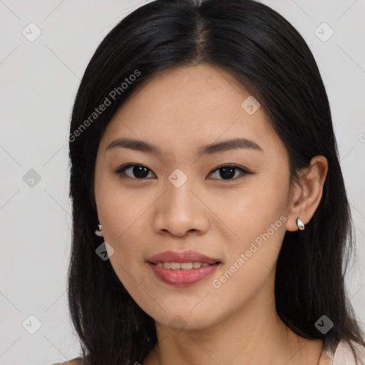 Joyful asian young-adult female with long  black hair and brown eyes