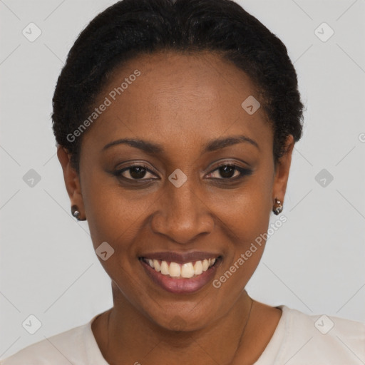 Joyful black young-adult female with short  black hair and brown eyes