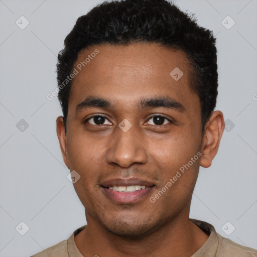 Joyful black young-adult male with short  black hair and brown eyes