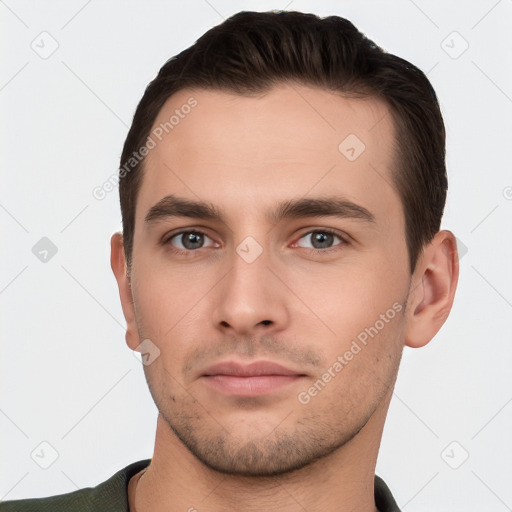 Neutral white young-adult male with short  brown hair and brown eyes