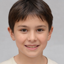 Joyful white child female with short  brown hair and brown eyes