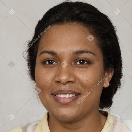 Joyful black adult female with medium  brown hair and brown eyes