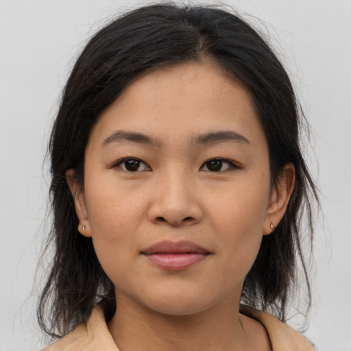 Joyful asian young-adult female with medium  brown hair and brown eyes