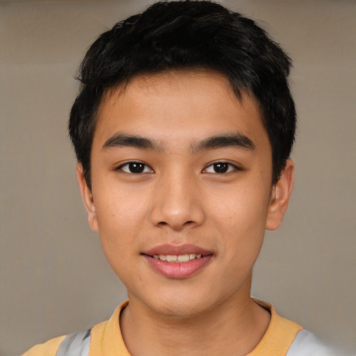 Joyful asian young-adult male with short  brown hair and brown eyes