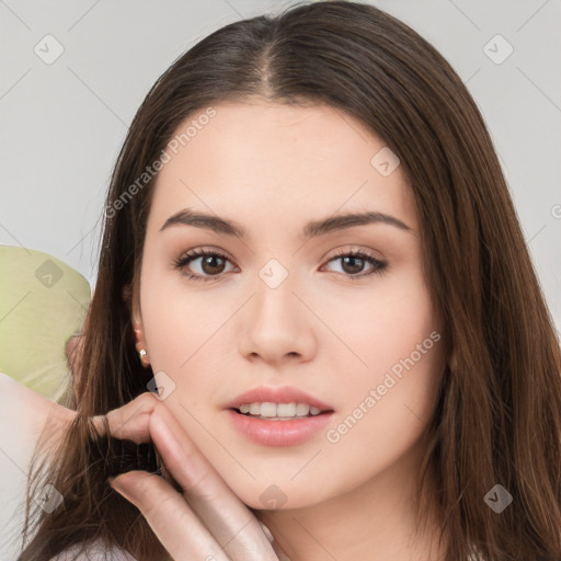 Neutral white young-adult female with long  brown hair and brown eyes