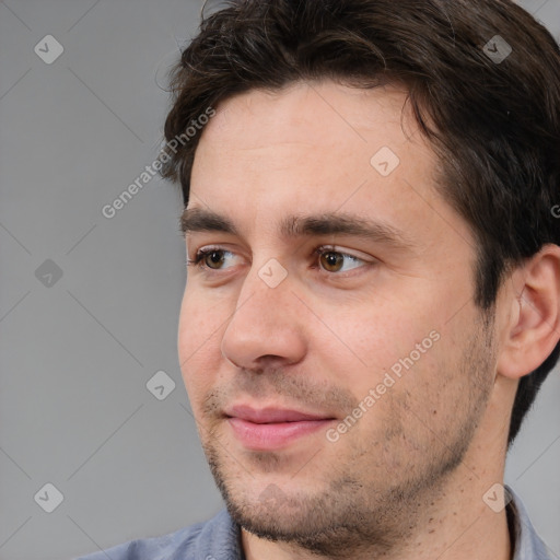 Joyful white adult male with short  brown hair and brown eyes