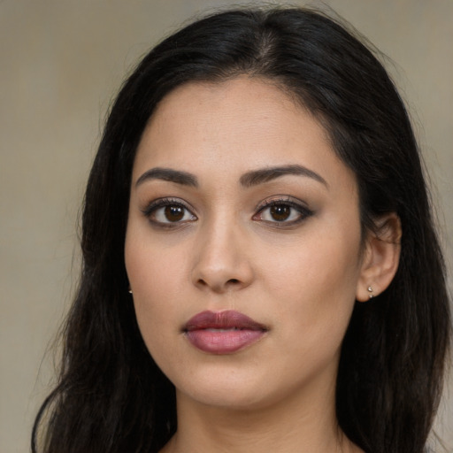 Neutral latino young-adult female with long  black hair and brown eyes