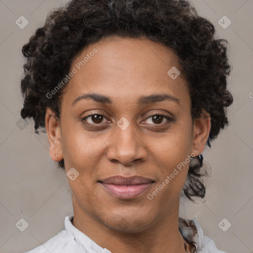 Joyful black adult female with short  brown hair and brown eyes