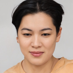 Joyful asian young-adult female with short  brown hair and brown eyes