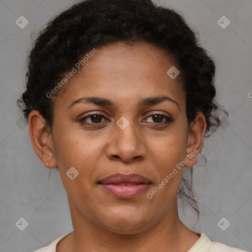 Joyful black adult female with short  brown hair and brown eyes