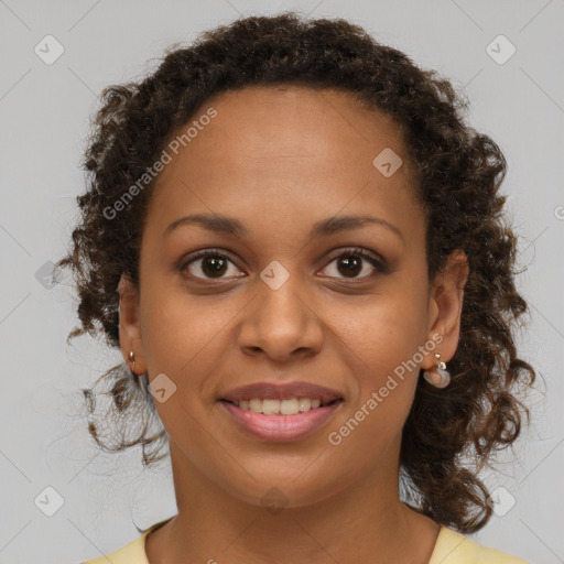 Joyful black young-adult female with medium  brown hair and brown eyes