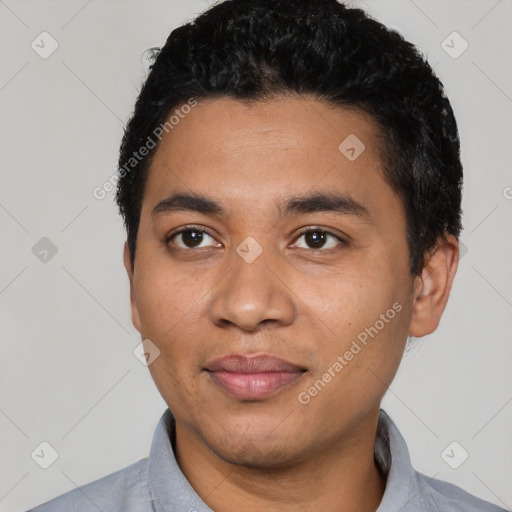 Joyful latino young-adult male with short  black hair and brown eyes