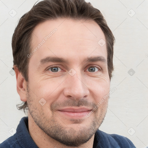 Joyful white adult male with short  brown hair and grey eyes