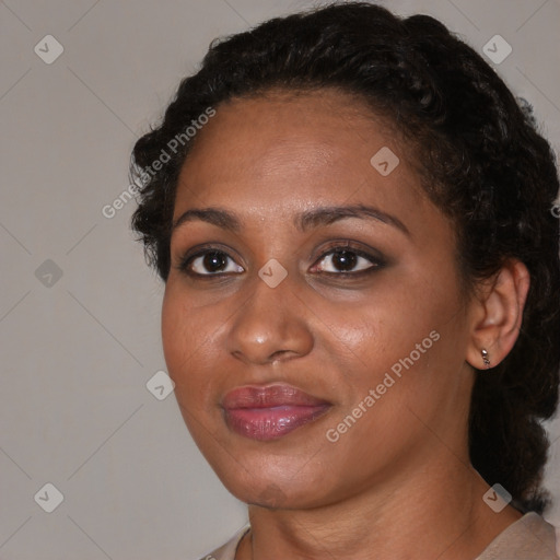 Joyful black young-adult female with medium  brown hair and brown eyes