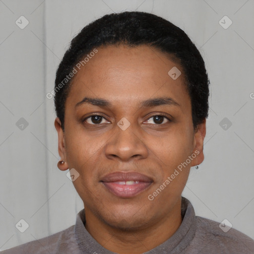 Joyful black young-adult female with short  black hair and brown eyes