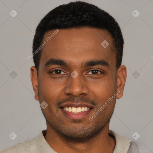 Joyful black young-adult male with short  black hair and brown eyes