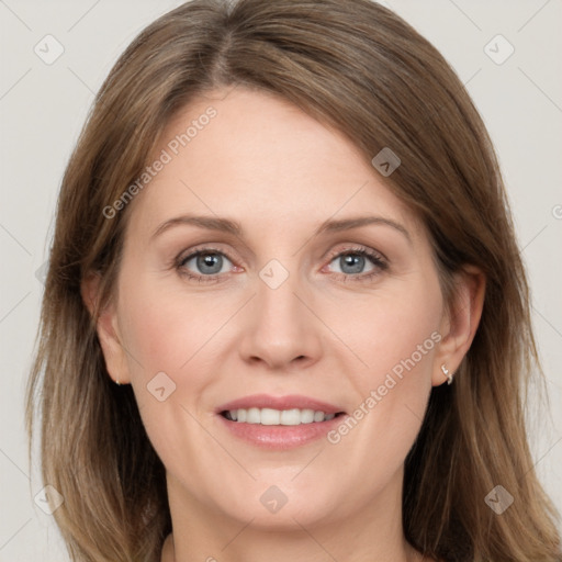 Joyful white adult female with medium  brown hair and grey eyes