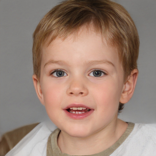 Joyful white child male with short  brown hair and blue eyes