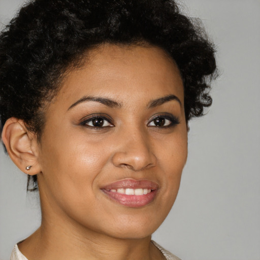 Joyful latino young-adult female with short  brown hair and brown eyes