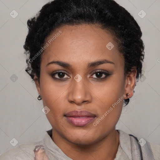 Joyful black young-adult female with short  black hair and brown eyes