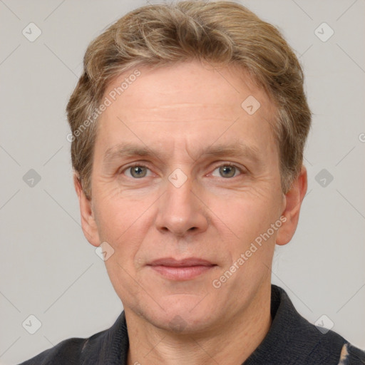 Joyful white adult male with short  brown hair and grey eyes