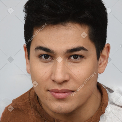 Joyful asian young-adult male with short  brown hair and brown eyes