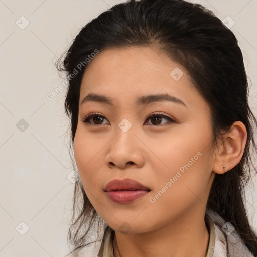 Joyful asian young-adult female with long  black hair and brown eyes