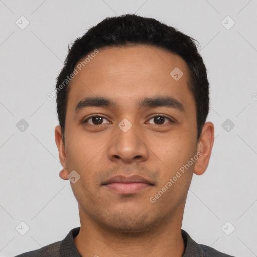 Neutral latino young-adult male with short  black hair and brown eyes