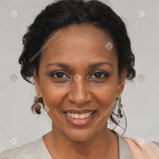 Joyful black adult female with short  brown hair and brown eyes
