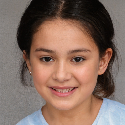 Joyful white child female with medium  brown hair and brown eyes