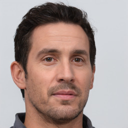 Neutral white adult male with short  brown hair and brown eyes