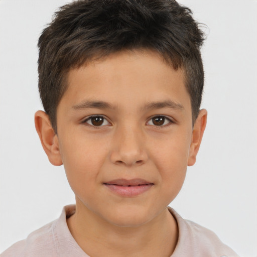Joyful white child male with short  brown hair and brown eyes