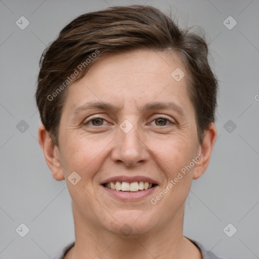 Joyful white adult female with short  brown hair and grey eyes