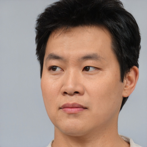 Neutral asian young-adult male with short  black hair and brown eyes