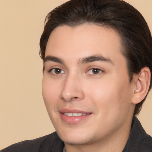 Joyful white young-adult male with medium  brown hair and brown eyes