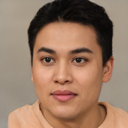 Joyful white young-adult male with short  black hair and brown eyes