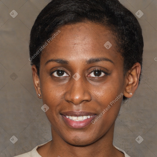 Joyful black young-adult female with short  brown hair and brown eyes