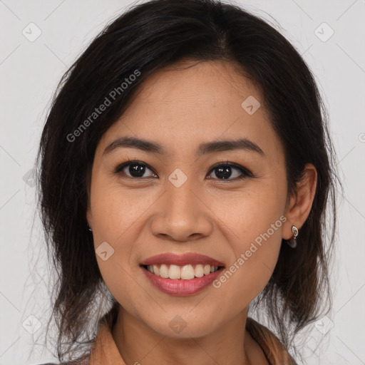 Joyful latino young-adult female with long  brown hair and brown eyes