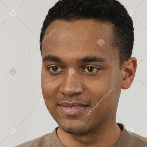 Joyful black young-adult male with short  black hair and brown eyes