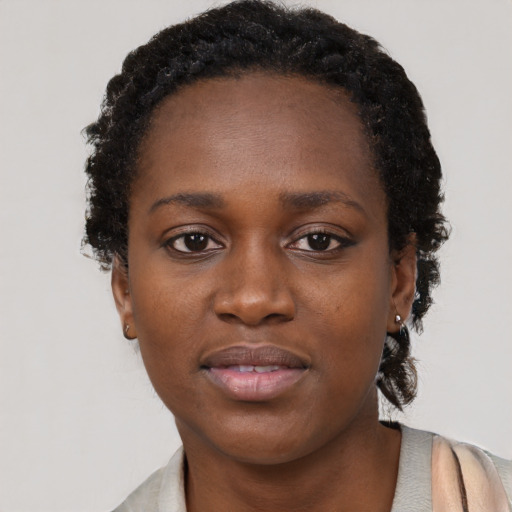 Neutral black young-adult female with short  brown hair and brown eyes