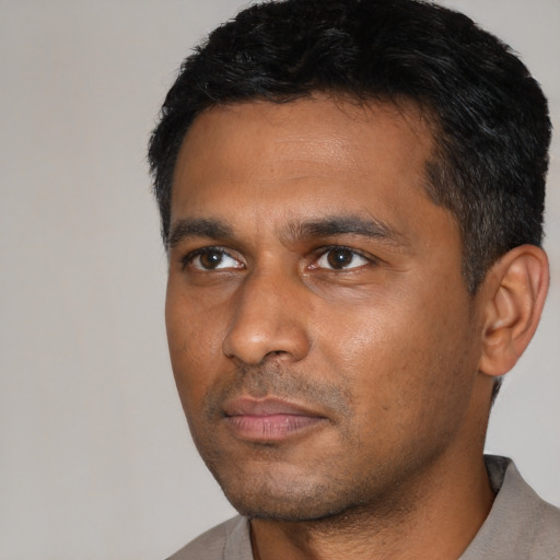 Neutral black young-adult male with short  black hair and brown eyes