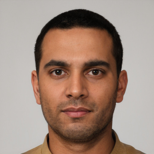 Neutral latino young-adult male with short  black hair and brown eyes