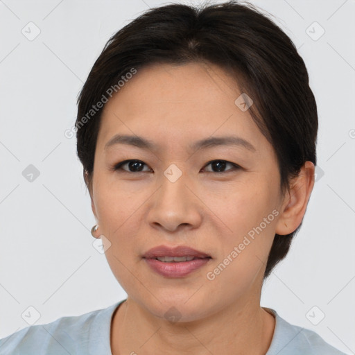 Joyful asian young-adult female with short  brown hair and brown eyes