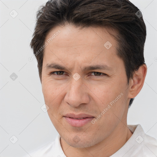 Joyful white adult male with short  brown hair and brown eyes