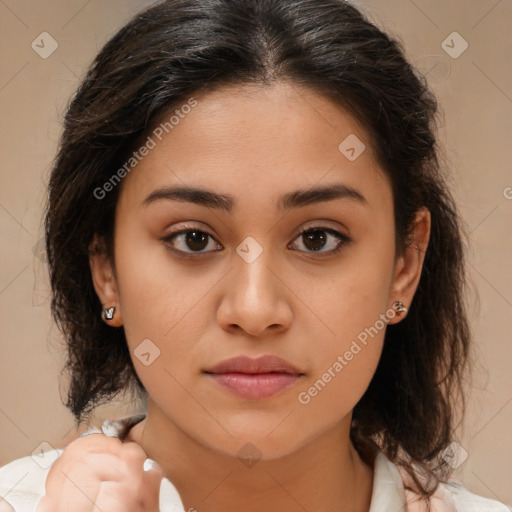 Joyful latino young-adult female with medium  brown hair and brown eyes